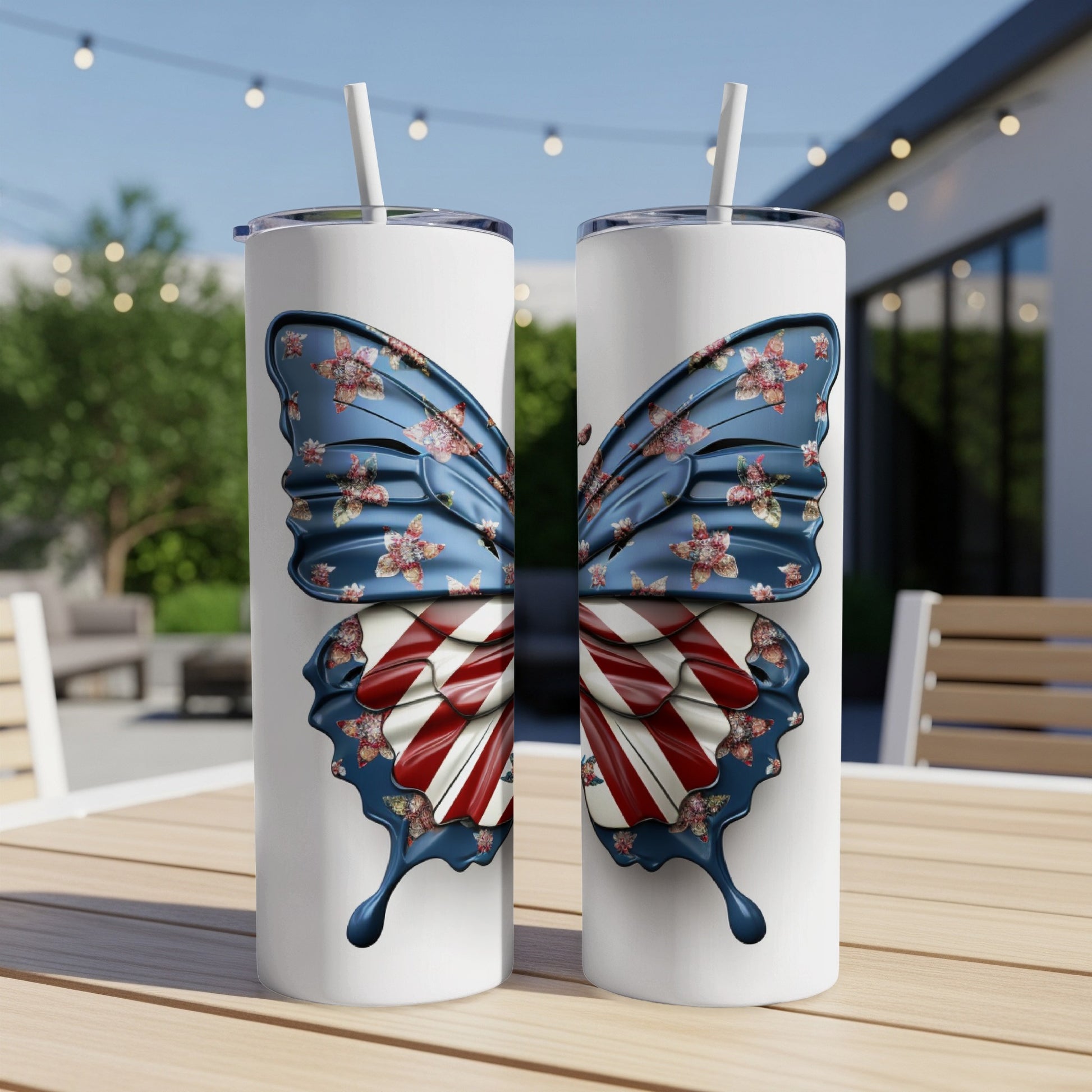 Two tall tumblers with a butterfly wing design featuring American flag stripes and floral accents.