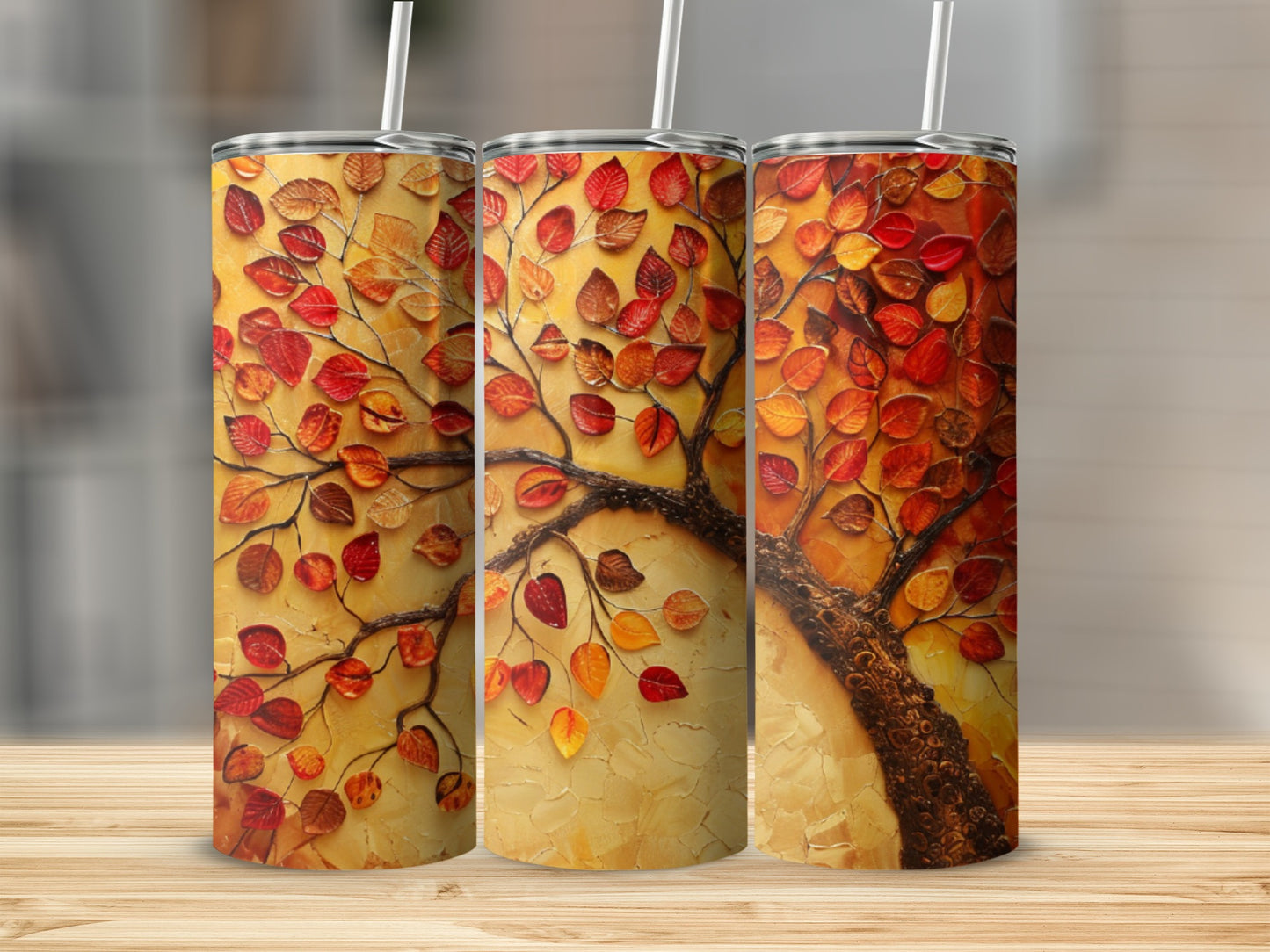 Three tumblers featuring a textured, vibrant orange and red autumn tree.