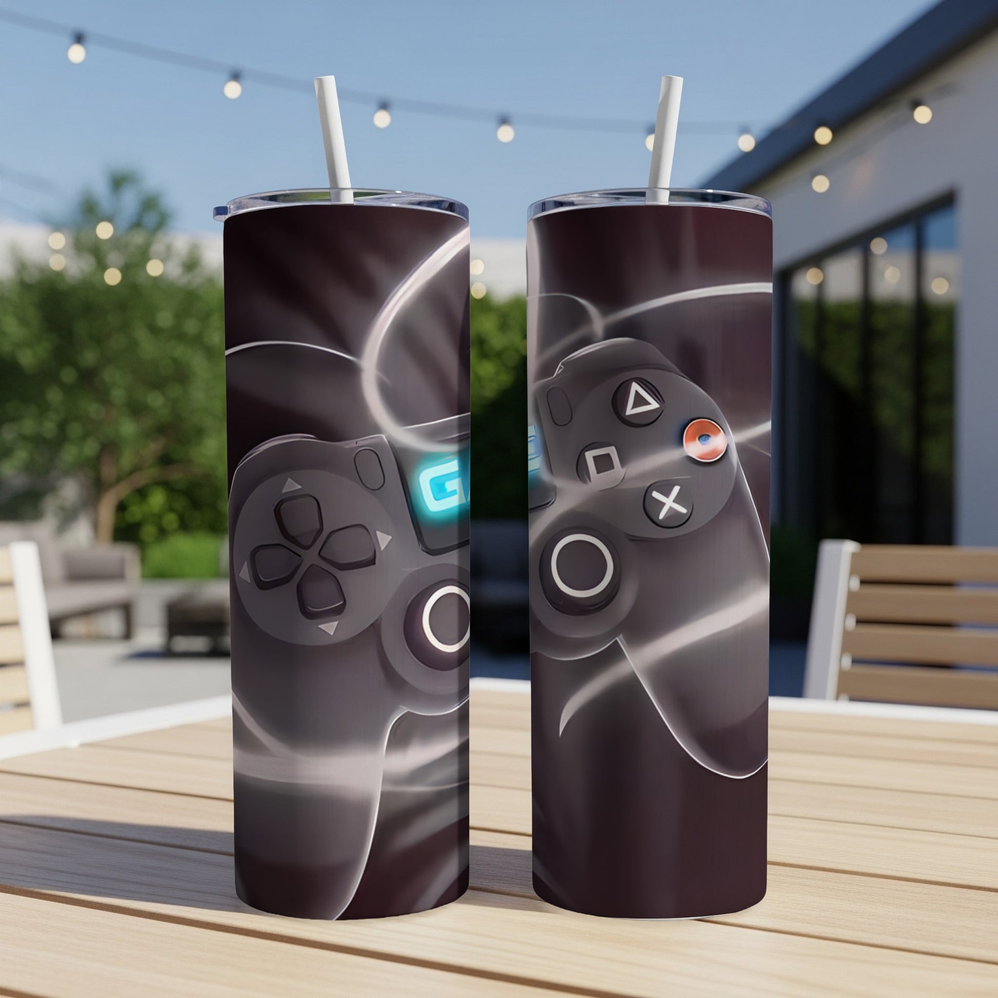 Two tumblers with a black video game controller design and glowing lines.