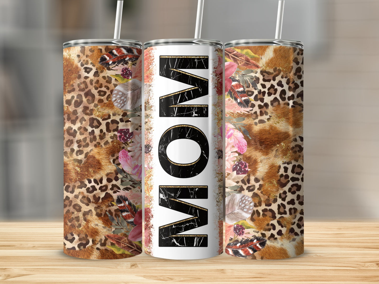 Tall tumbler with "MOM" in large white letters and animal print design.