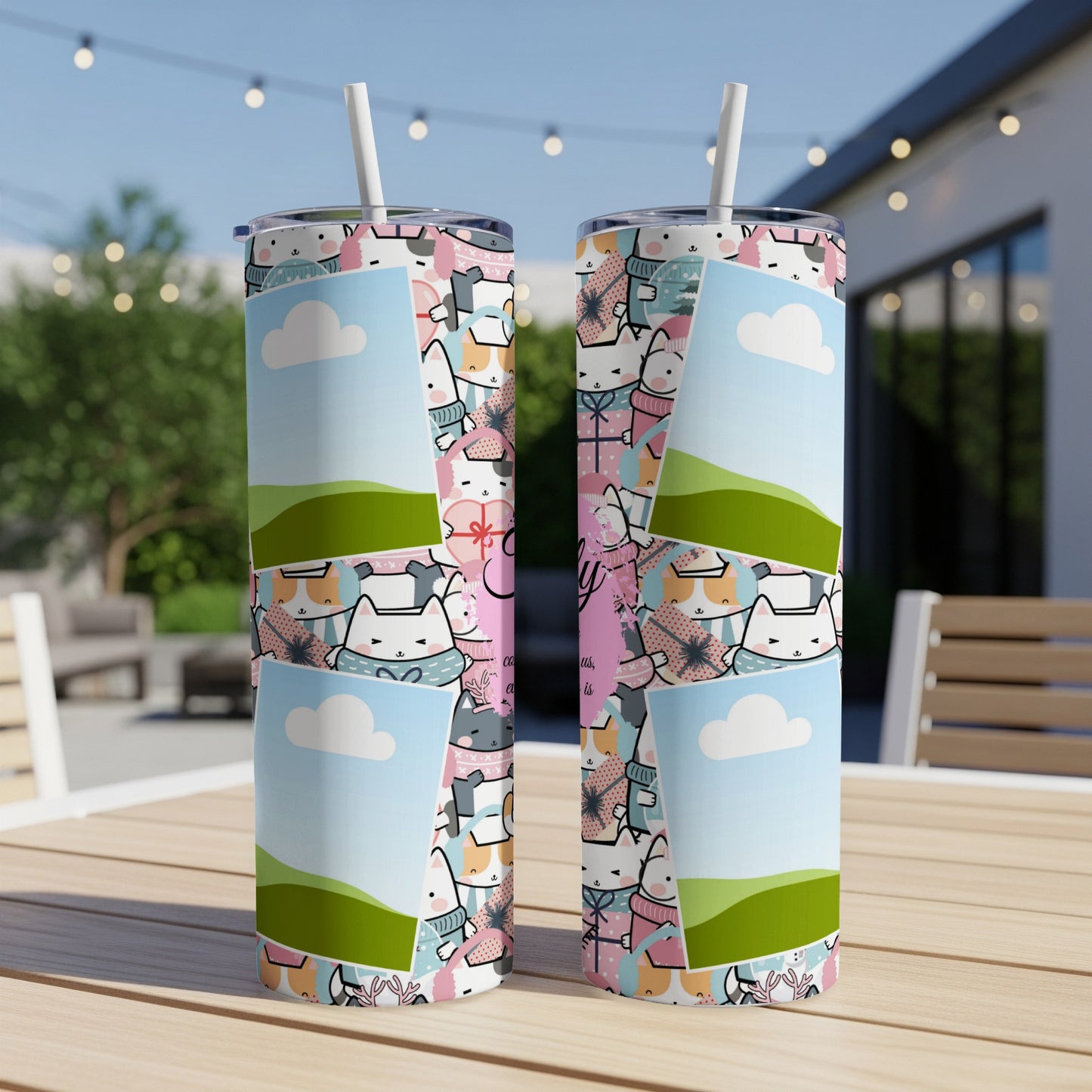 Two tumblers featuring a pattern of cute cats and clouds on a wooden table.