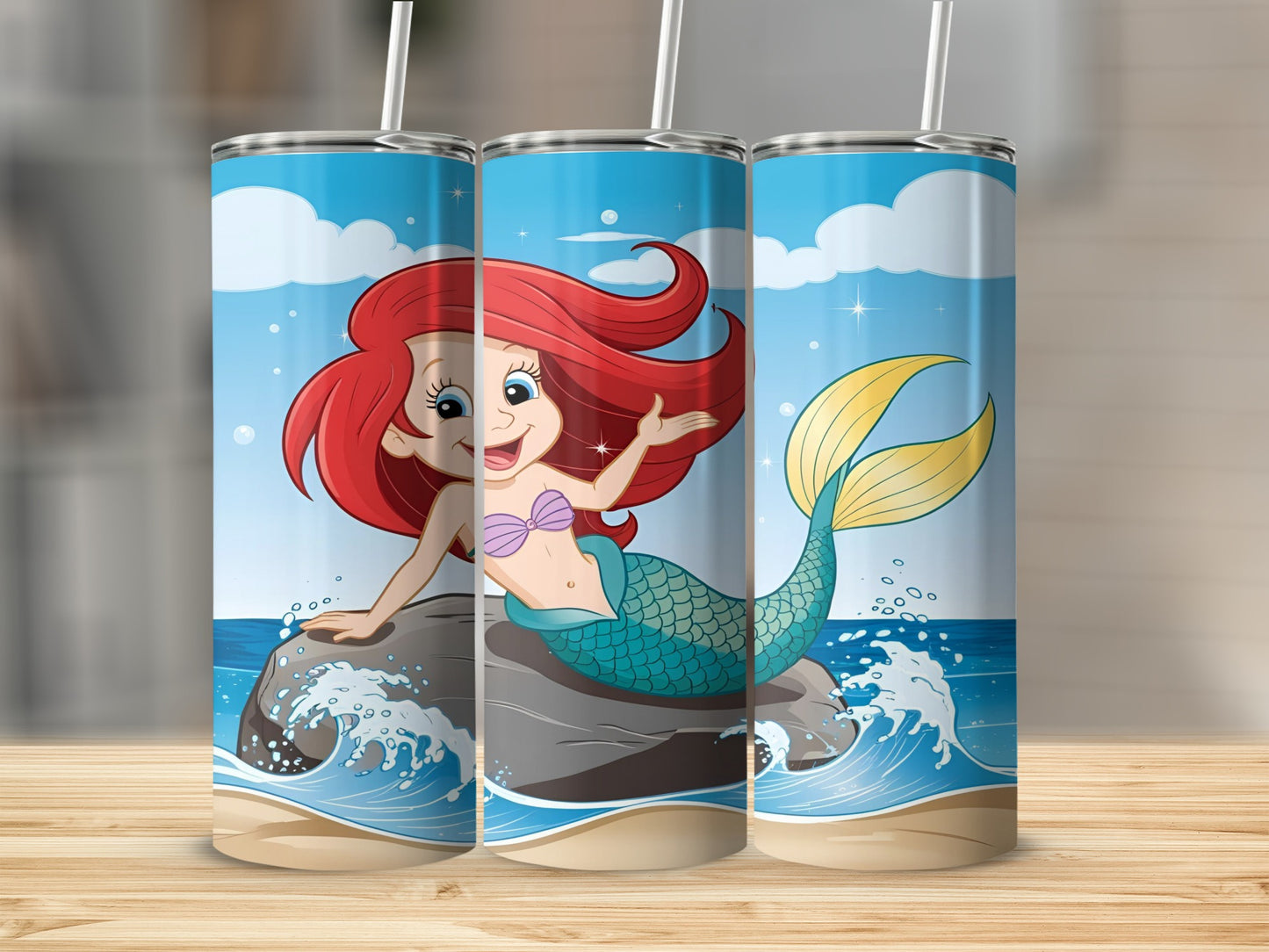 Cartoon mermaid with red hair and a teal tail sitting on a rock.