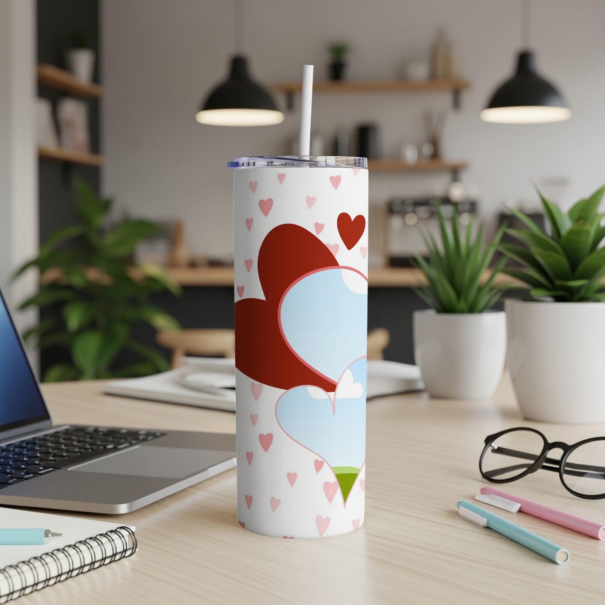White tumbler with scattered pink hearts and large heart design.