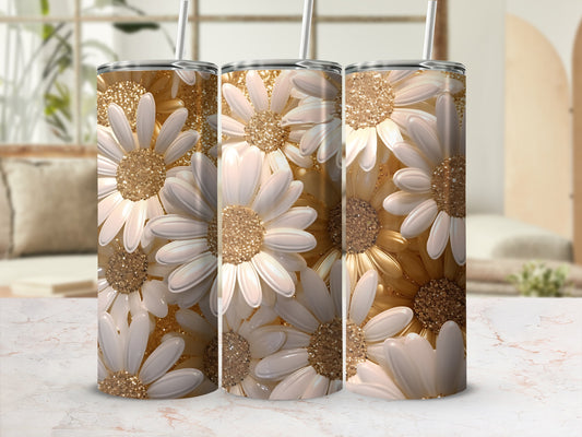 Three tumblers with white and gold floral glitter design and straws.