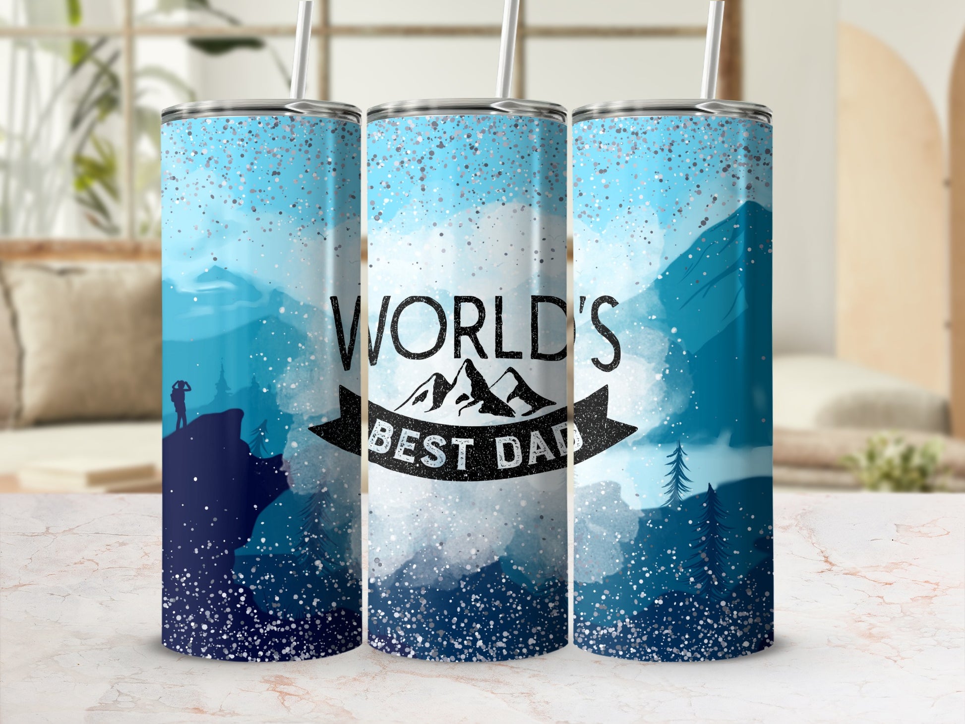 Tumblers with "World's Best Dad" text and mountain landscape design.