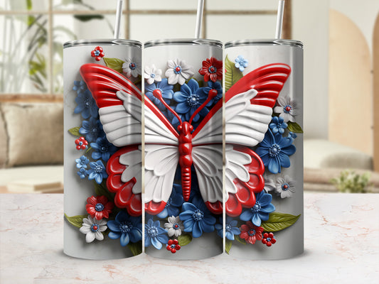 Tumbler with red and white butterfly and blue and red flowers.