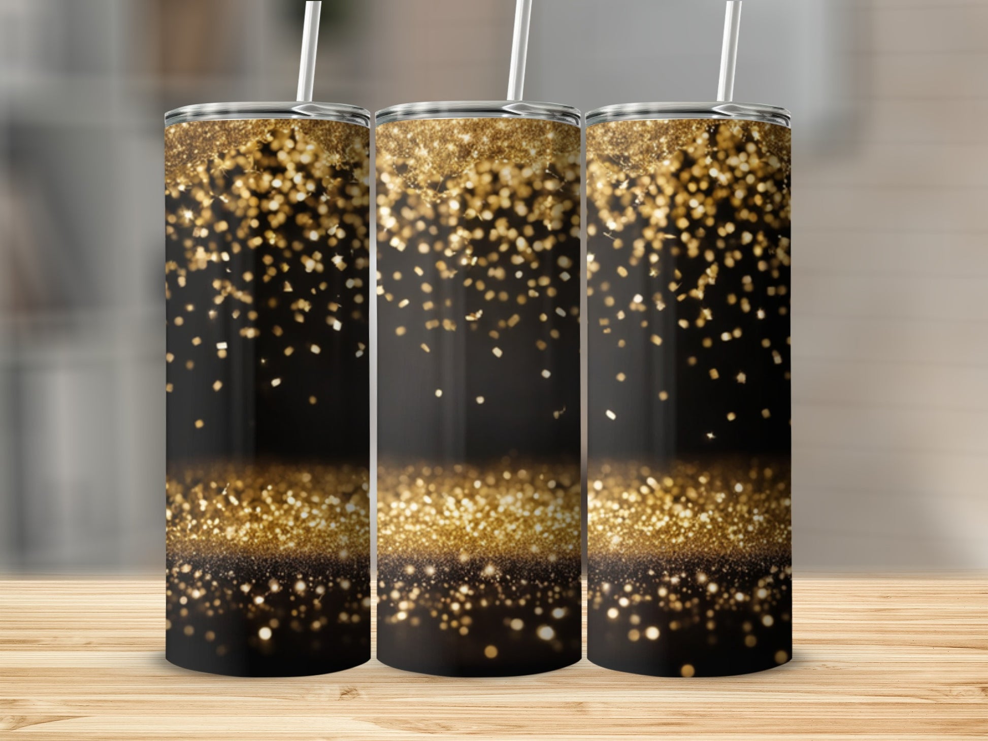 Three tumblers with gold glitter falling on a black background.