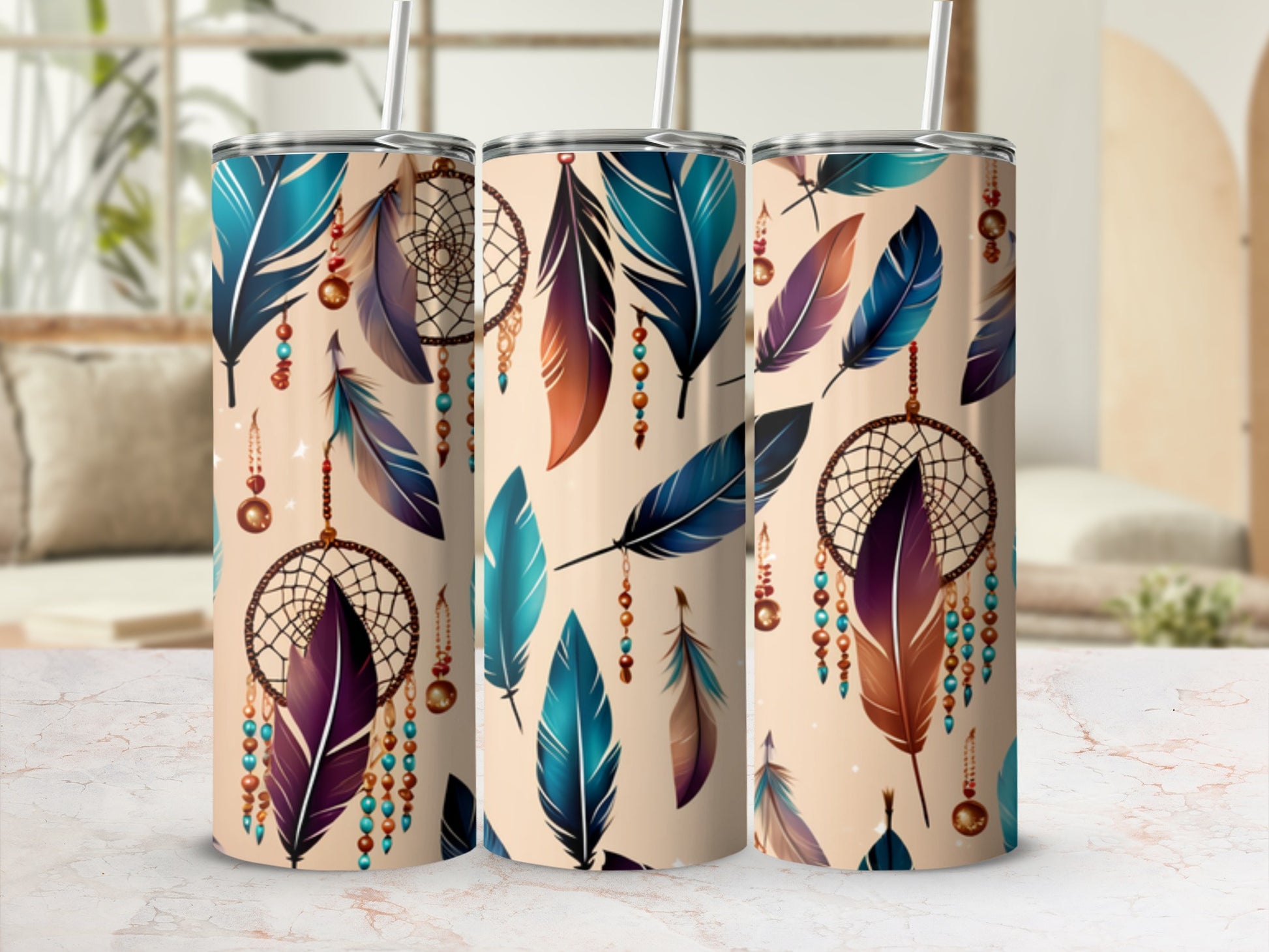 Three tumblers with feather and dreamcatcher designs.