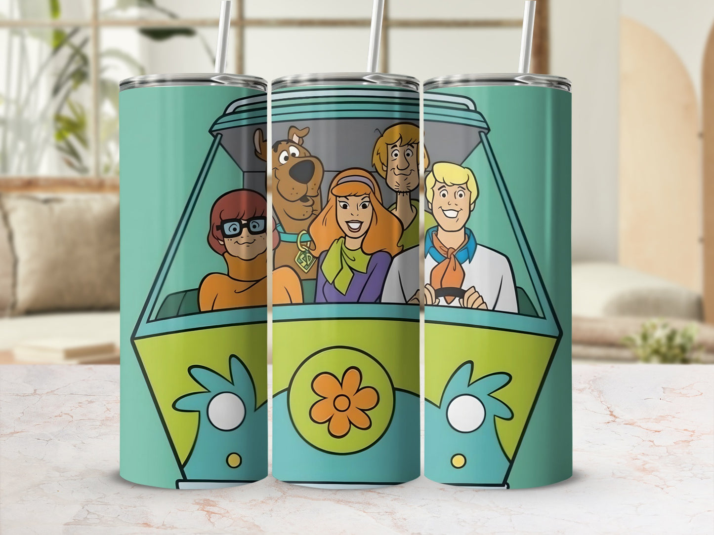 Scooby-Doo characters in the Mystery Machine on a blue tumbler.