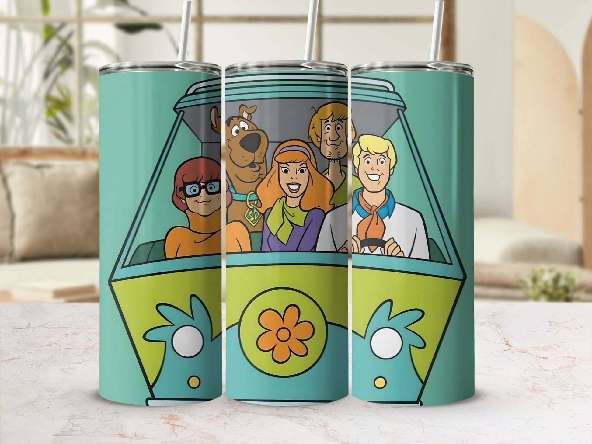 Scooby-Doo characters in the Mystery Machine on a blue tumbler.
