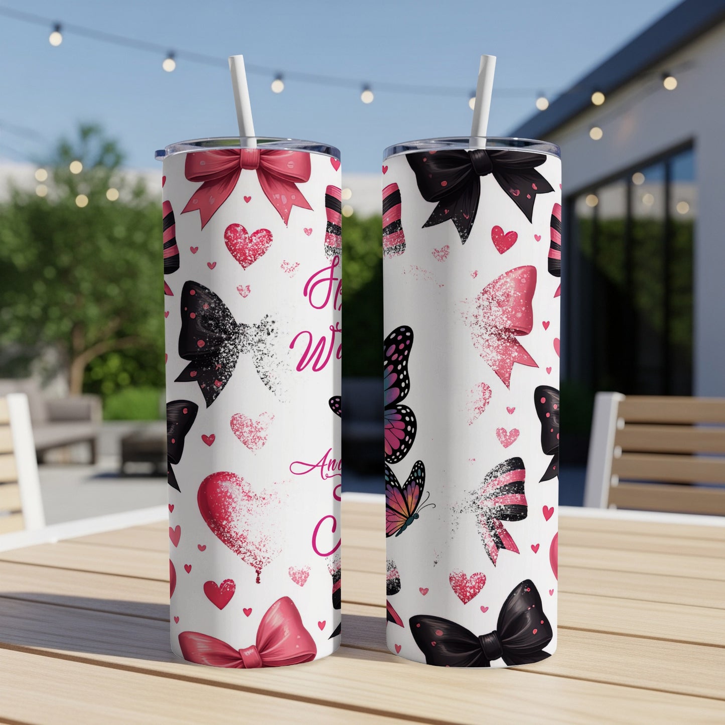 Two white tumblers with pink and black bow and heart pattern.