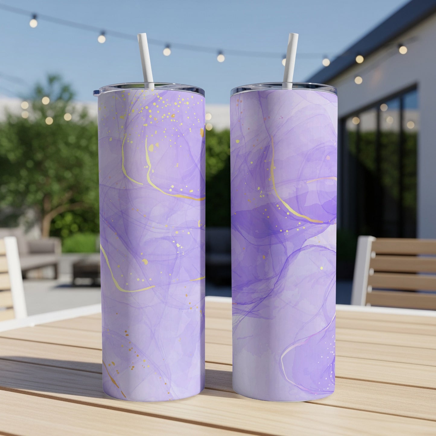 Two purple abstract marble pattern tumblers with gold accents and straws.