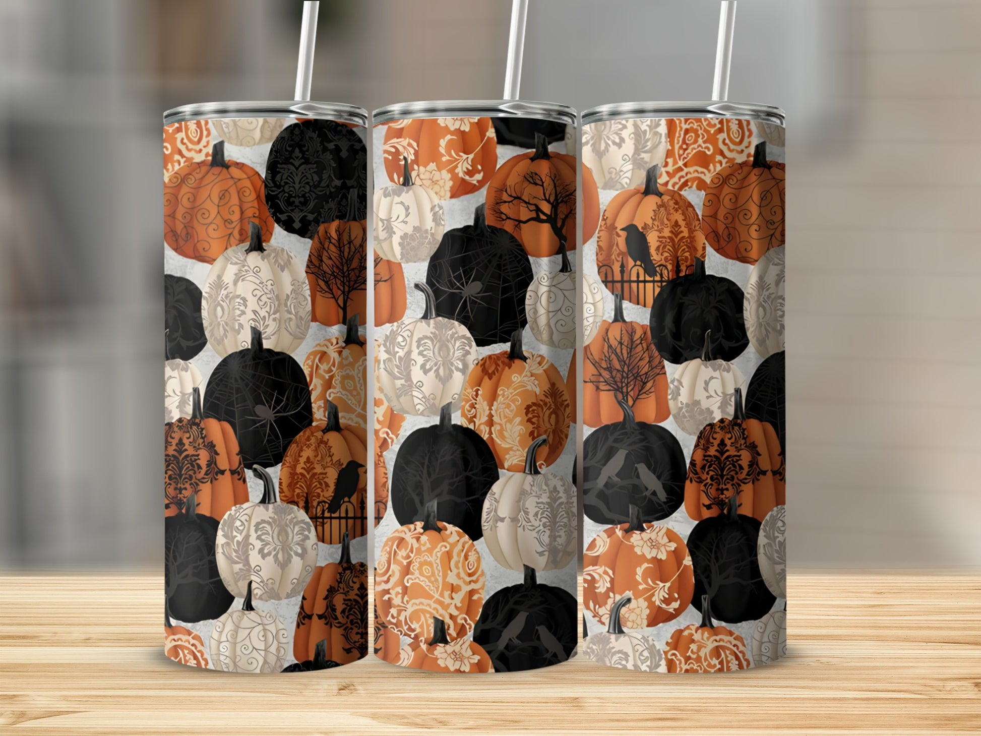 Three tumblers with a Halloween pumpkin and damask pattern.