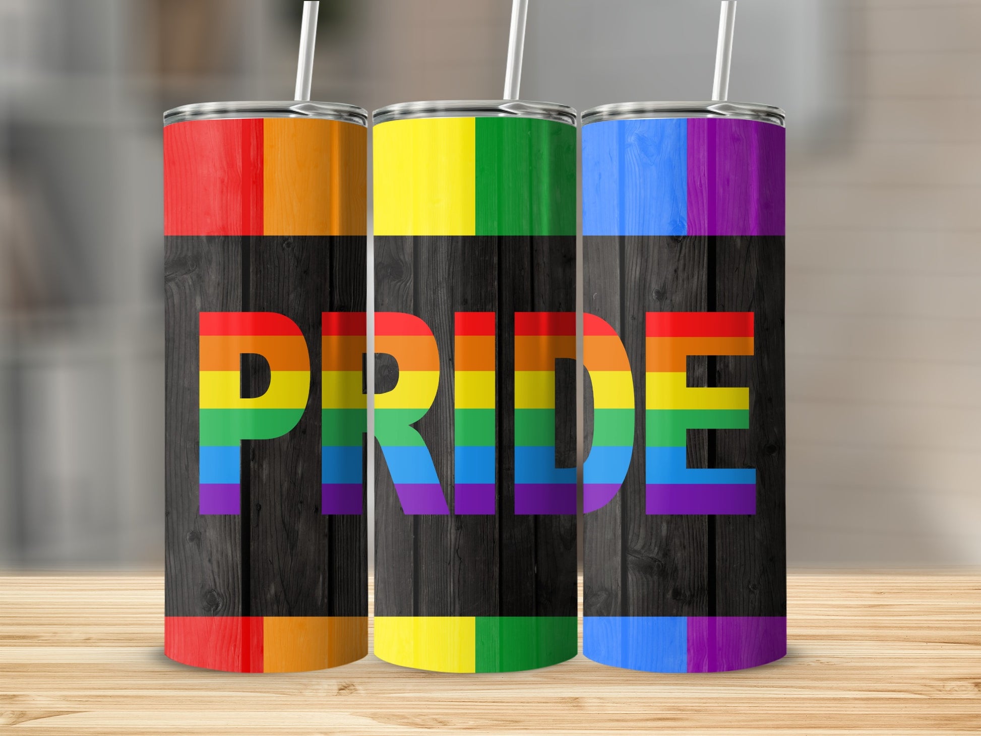 Three tumblers with rainbow pride flag colors and "Pride" text.