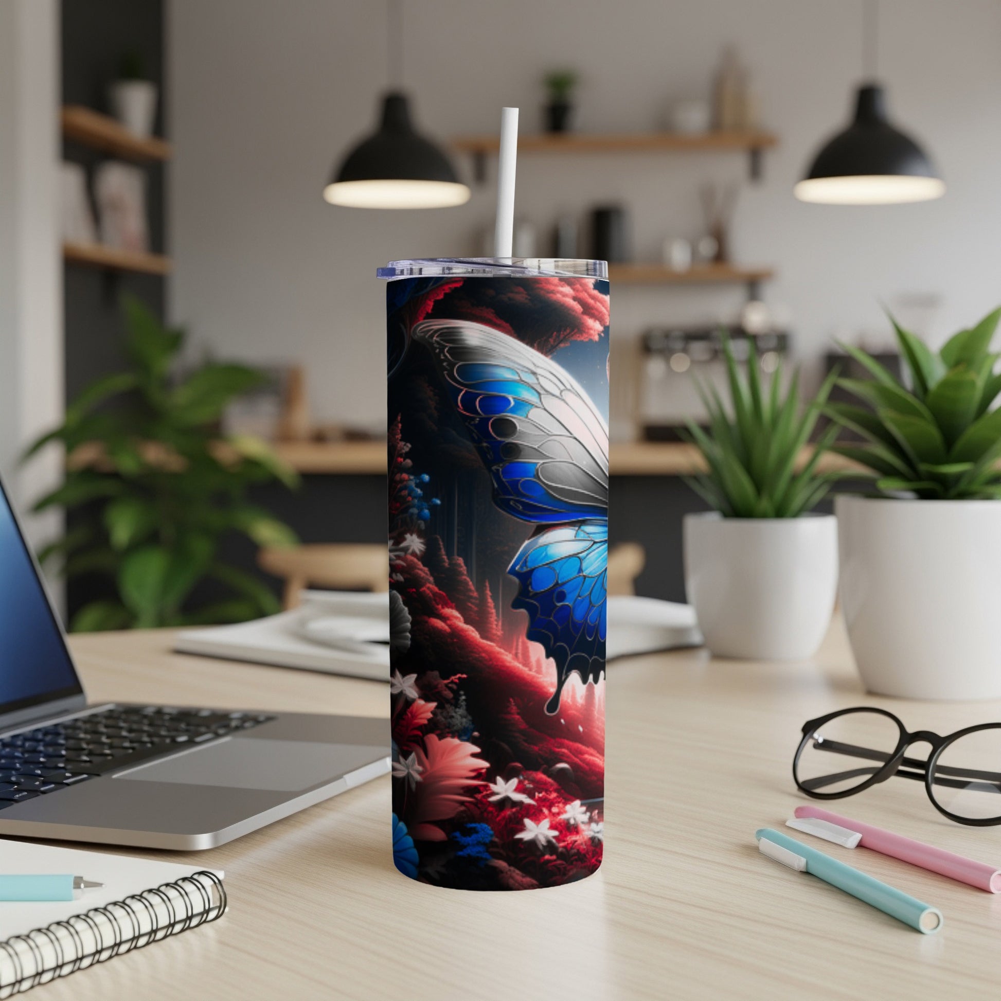 Tall tumbler with blue butterfly and floral pattern.