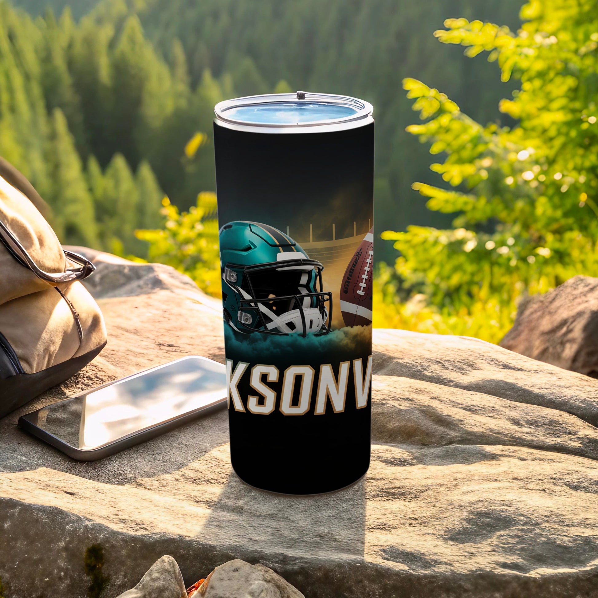 Black tumbler with Jacksonville Jaguars helmet and football graphic.