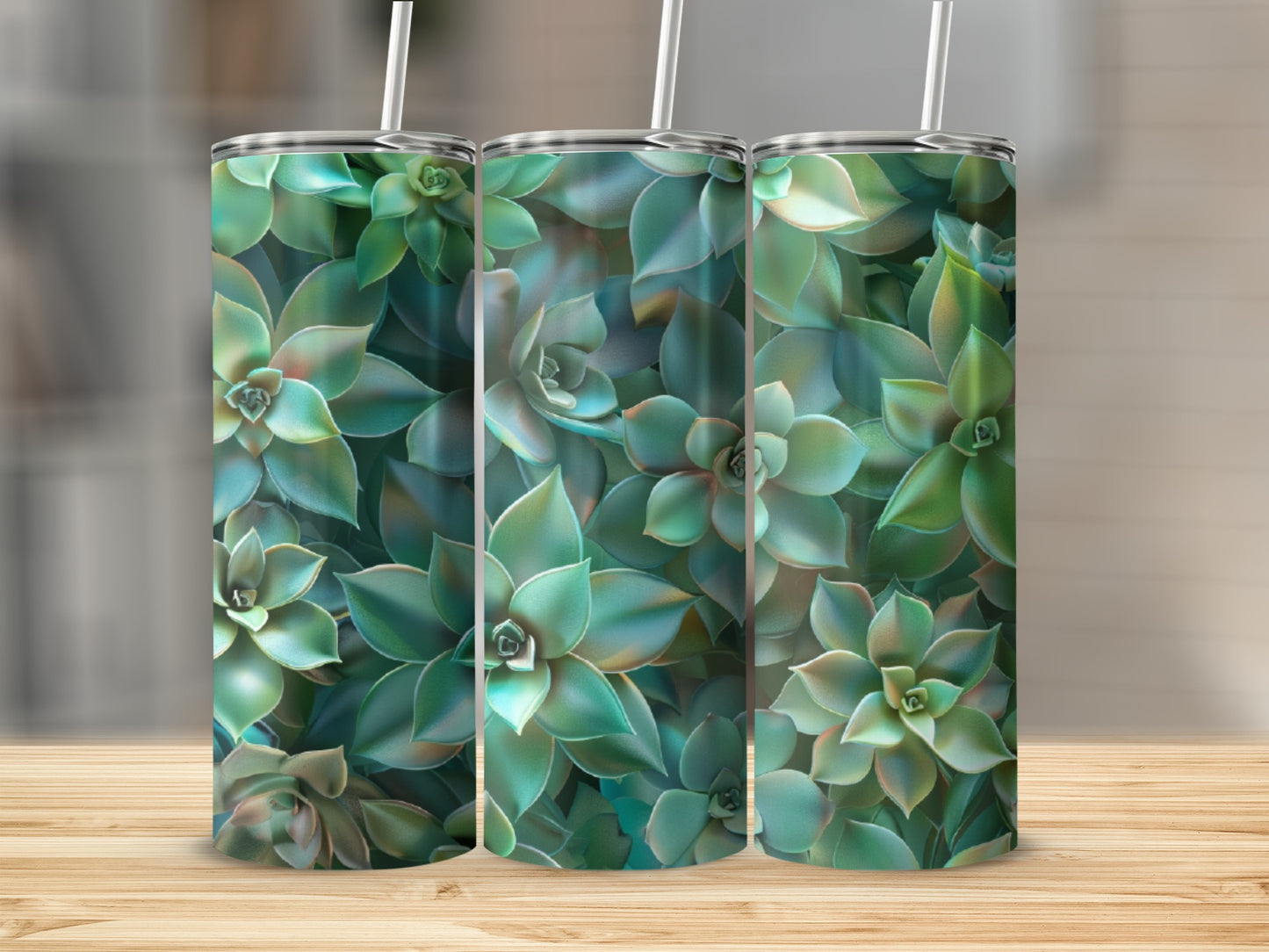 Three tumblers with a succulent plant pattern stand on a wooden surface.