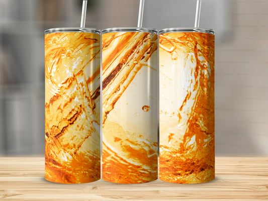 Three tumblers with abstract orange and white marbled patterns and straws.