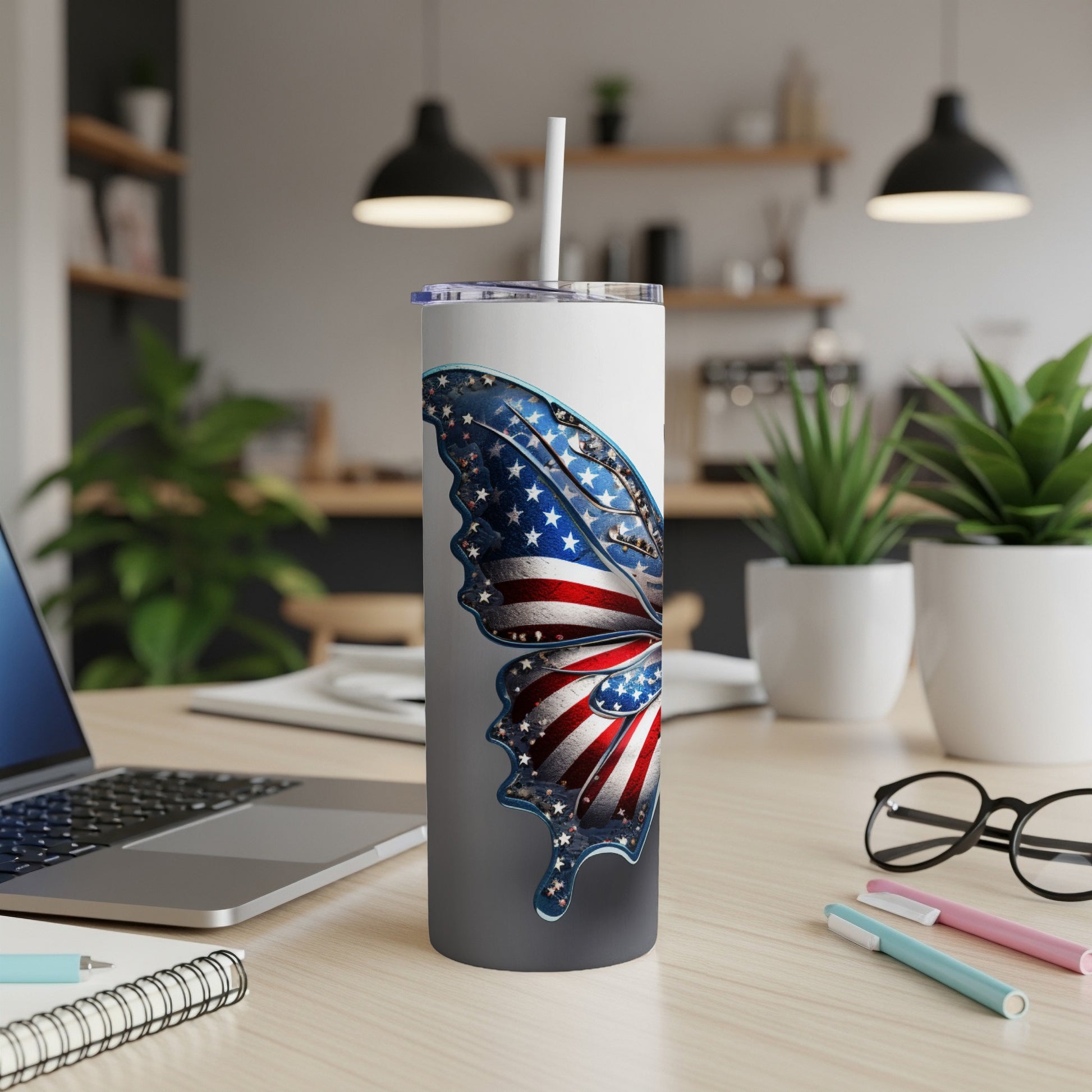 Tumbler with a patriotic butterfly design featuring stars and stripes.