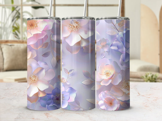 Three tumblers with floral designs in pastel purple and pink hues.