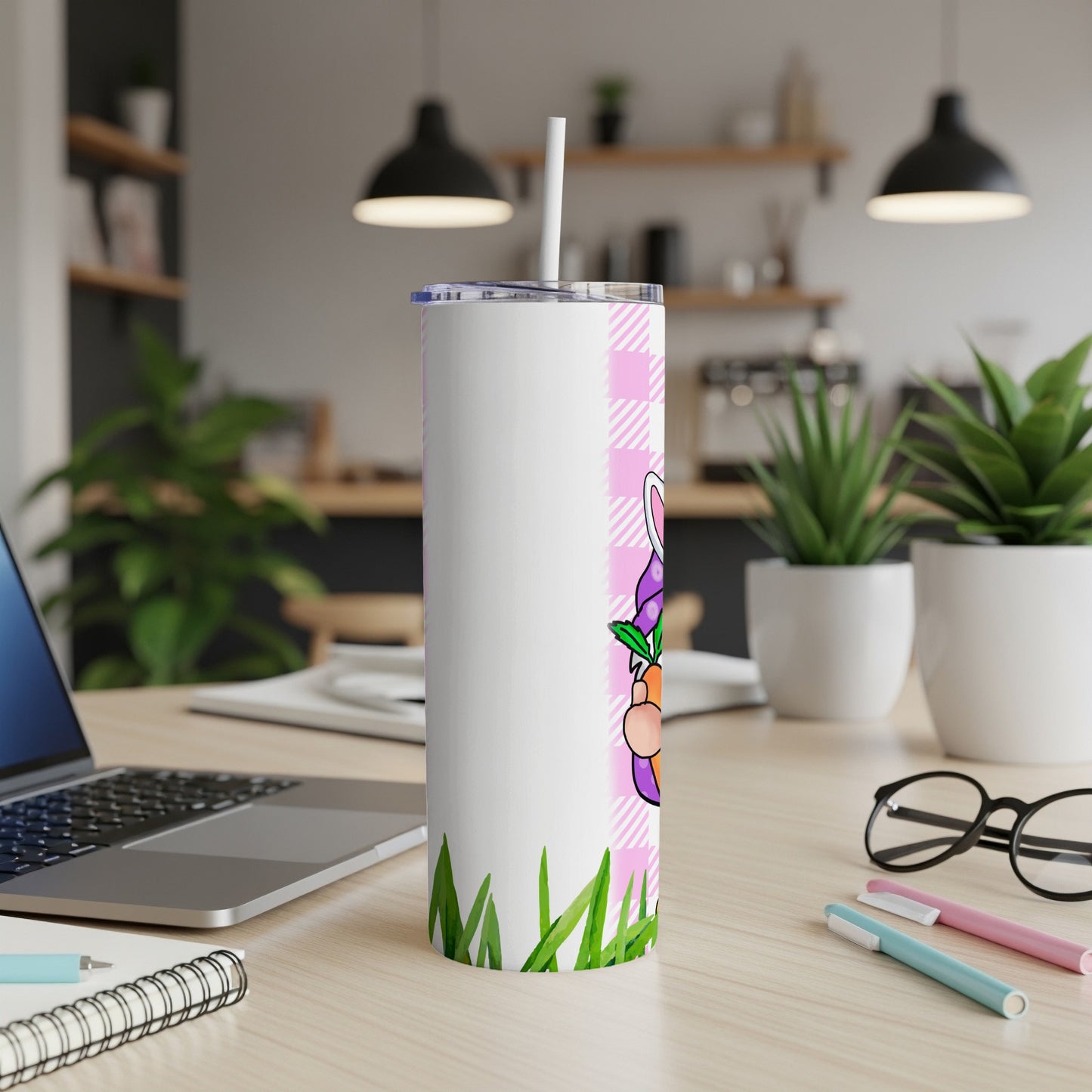 White tumbler with Easter bunny and carrot design on pink plaid.