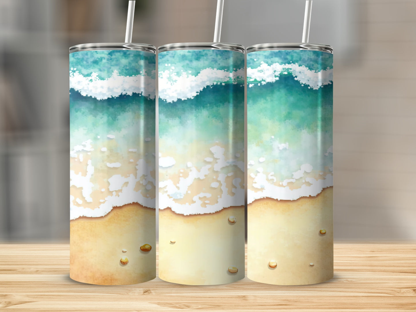 Three tumblers with a beach wave and sand design.