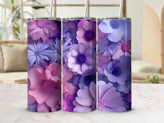 Three floral tumblers with purple and pink paper flowers against a blurred background.