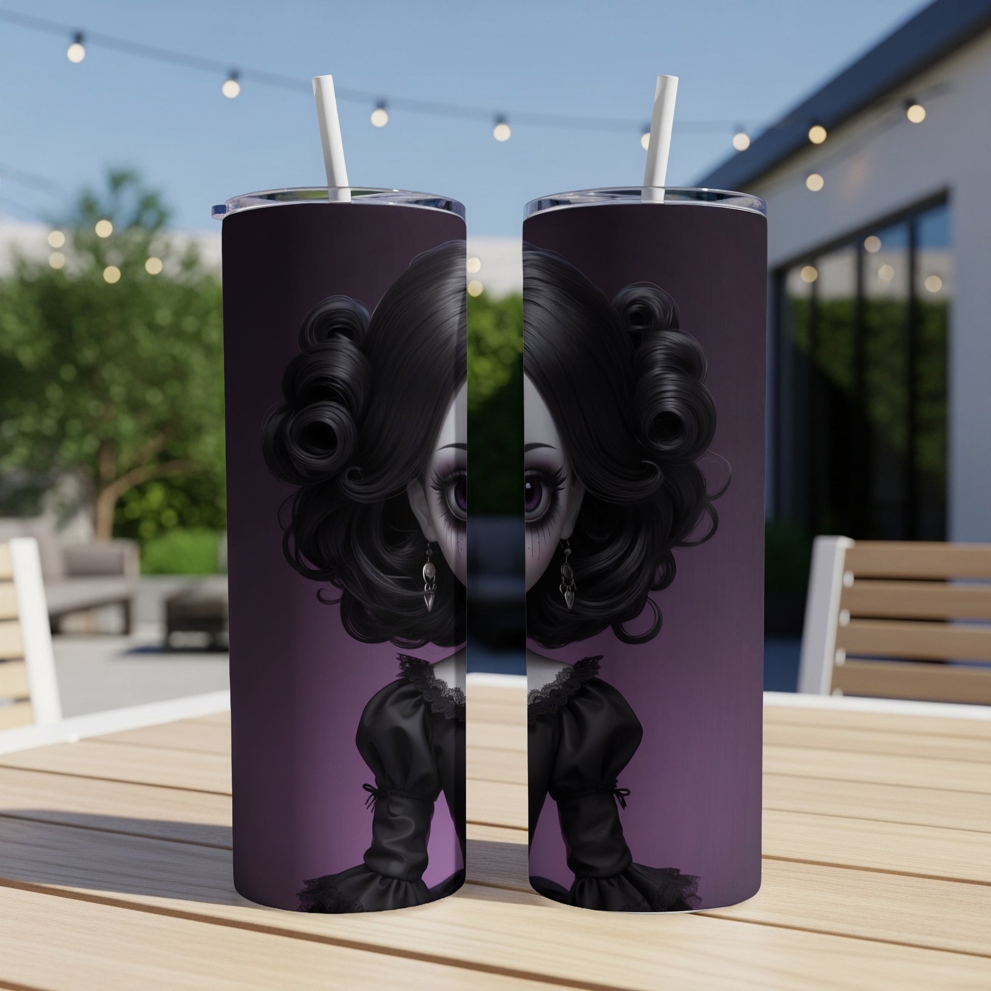 Two purple tumblers with gothic doll illustration on a wooden table.