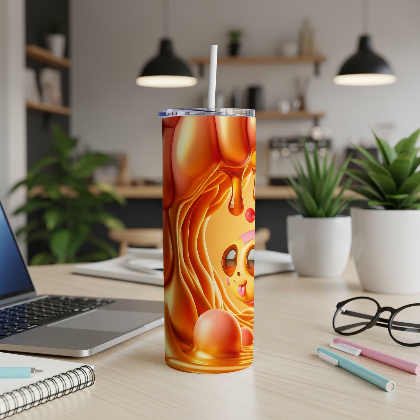 Orange cartoon cat face with honey dripping on a stainless steel tumbler.