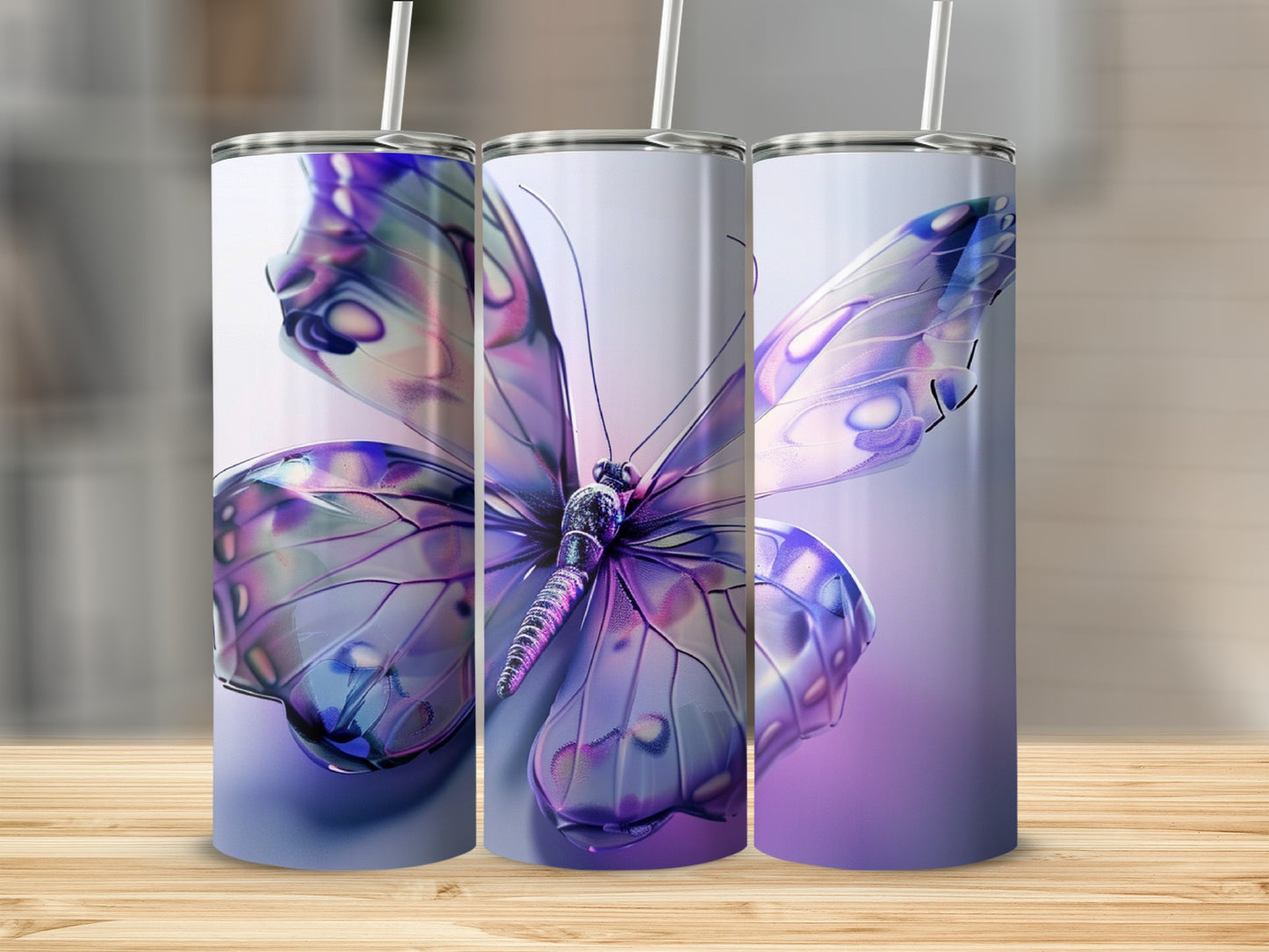 Three iridescent purple butterfly tumblers with straws on a wooden surface.