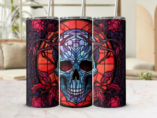 Stained glass skull with floral design, on a tumbler.