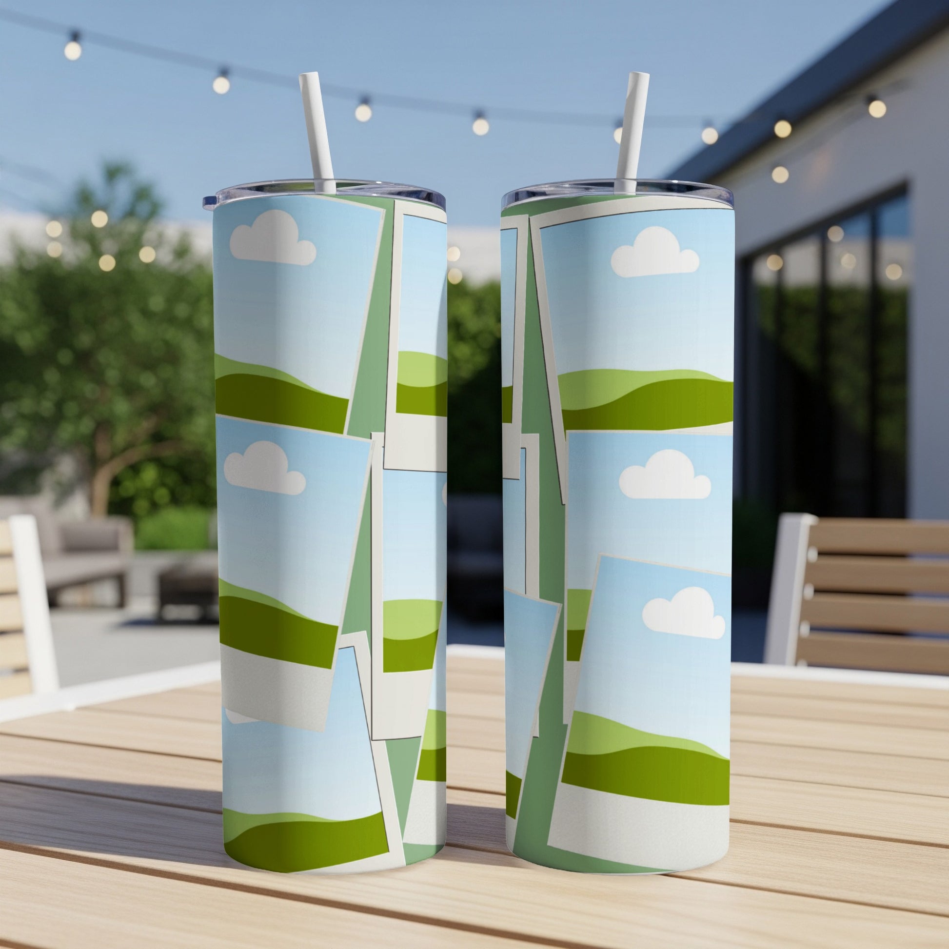 Two tumblers with a collage of rolling green hills and blue sky with clouds.