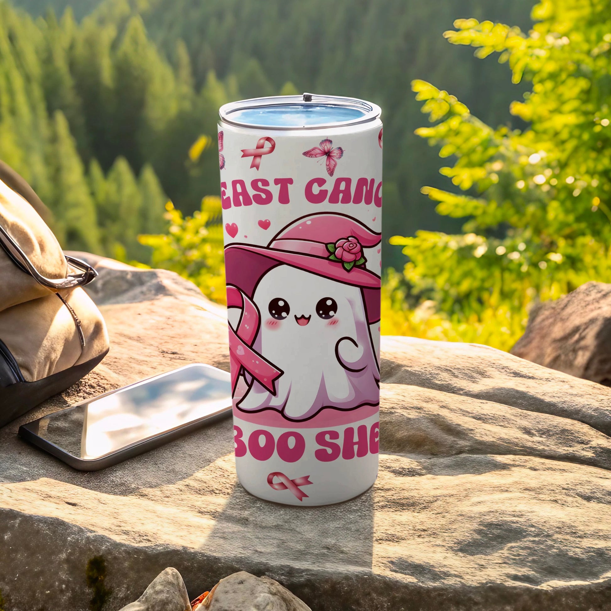 White tumbler with pink ghost wearing hat, "Boo She" text, and breast cancer ribbons.