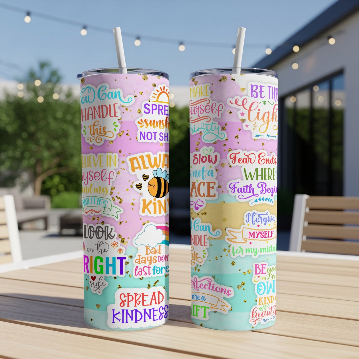 Two tall tumblers with colorful lettering and illustrations, reading "Spread Kindness."