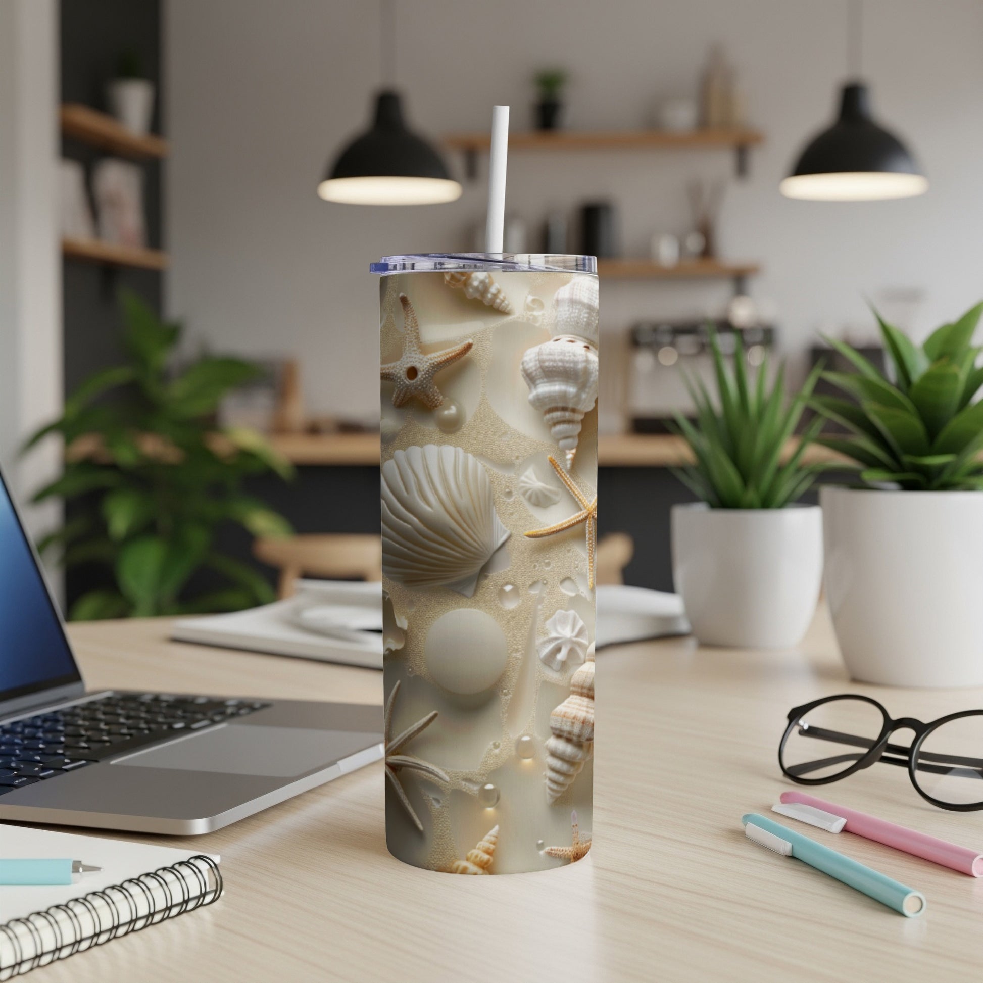 Beach seashell pattern on a tumbler with a straw.