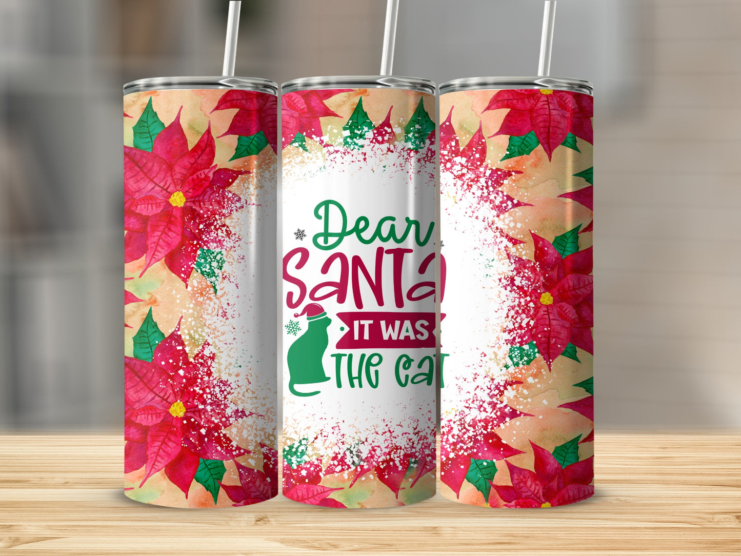 Three tumblers with poinsettia and "Dear Santa it was the cat" text.