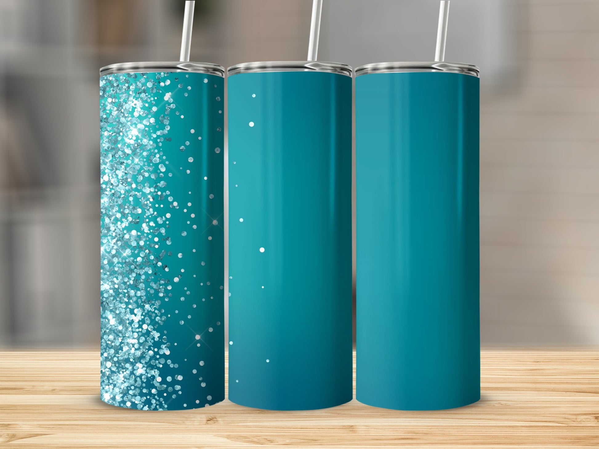 Three tumblers with straws, one with glitter, two solid teal.
