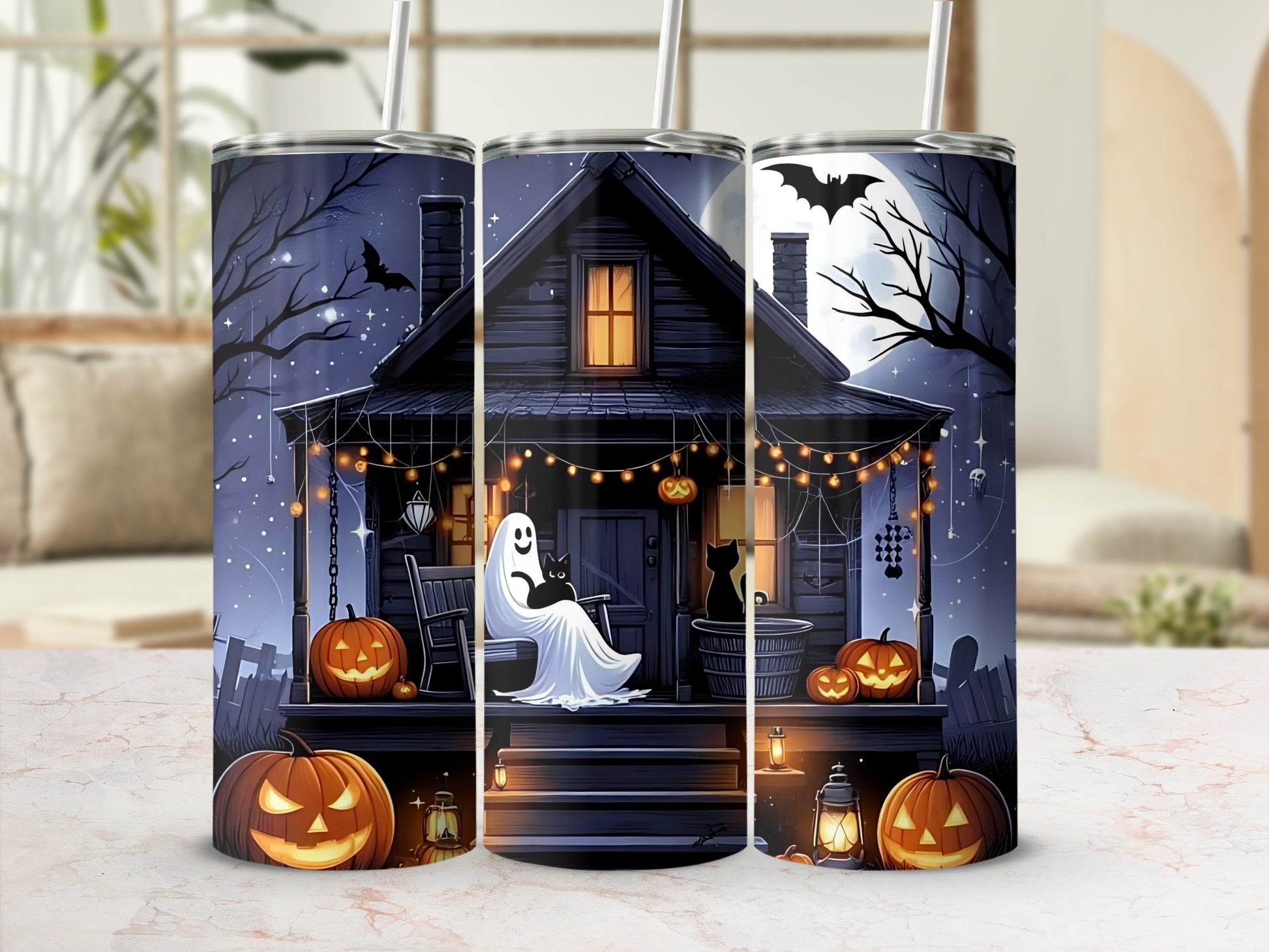 Halloween tumbler with a haunted house, ghost, black cats, bats, and jack-o'-lanterns.