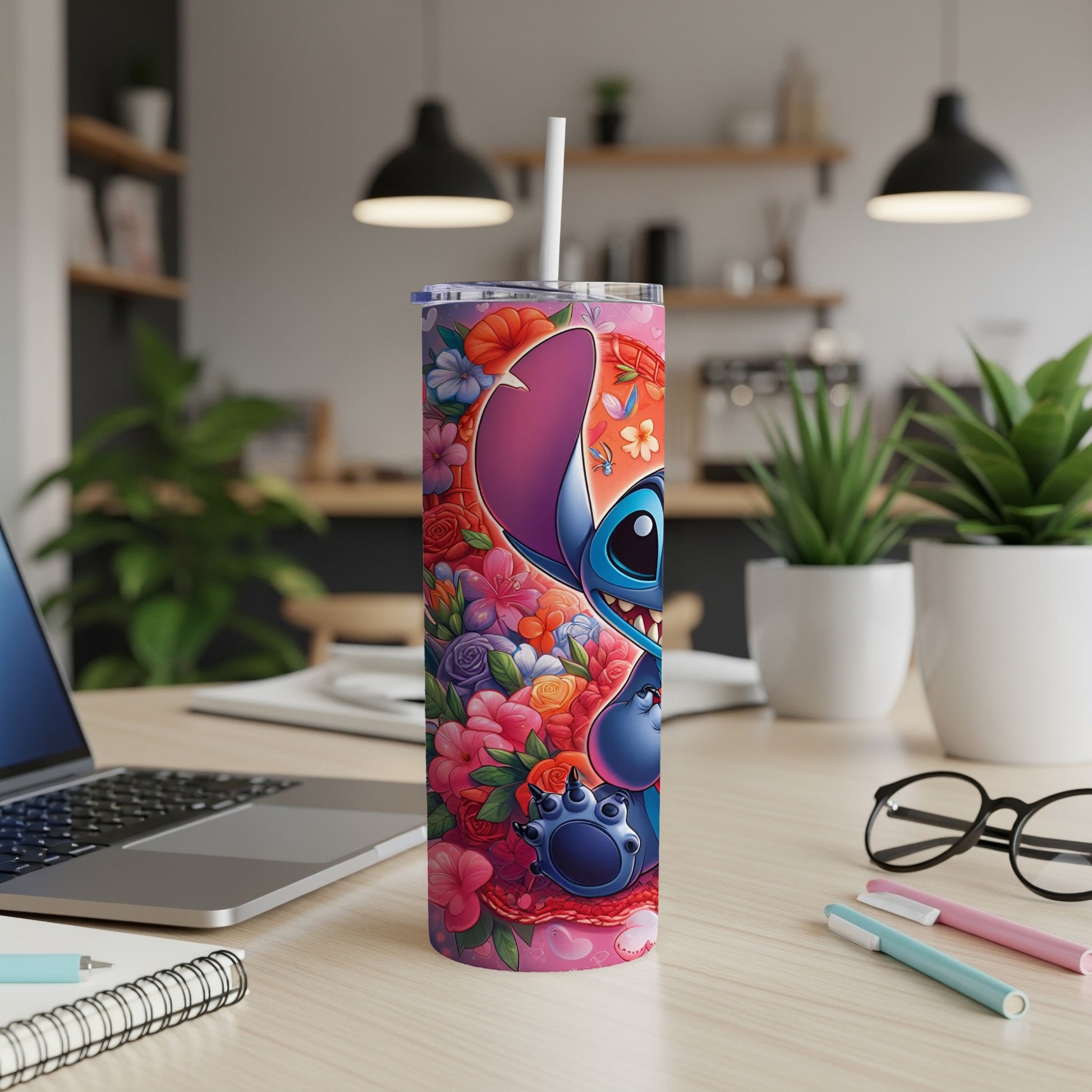 Stitch character with colorful floral pattern on a white skinny tumbler.