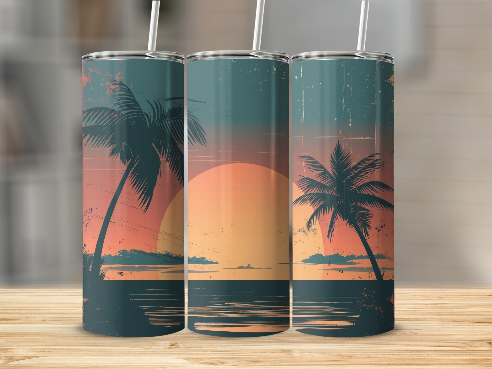 Three tumblers featuring a sunset beach scene with palm trees.