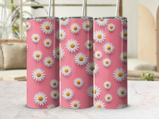 Pink tumbler with repeating white daisy pattern and straw.