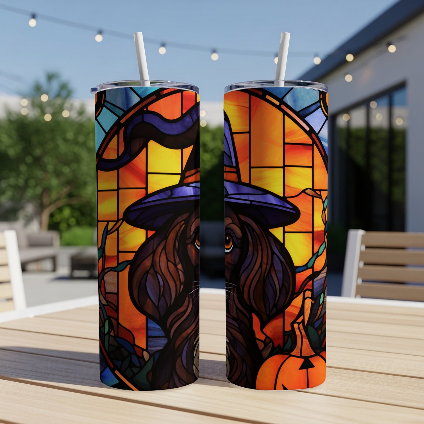 Two tumblers with stained-glass style Halloween art featuring a black cat in a witch hat.