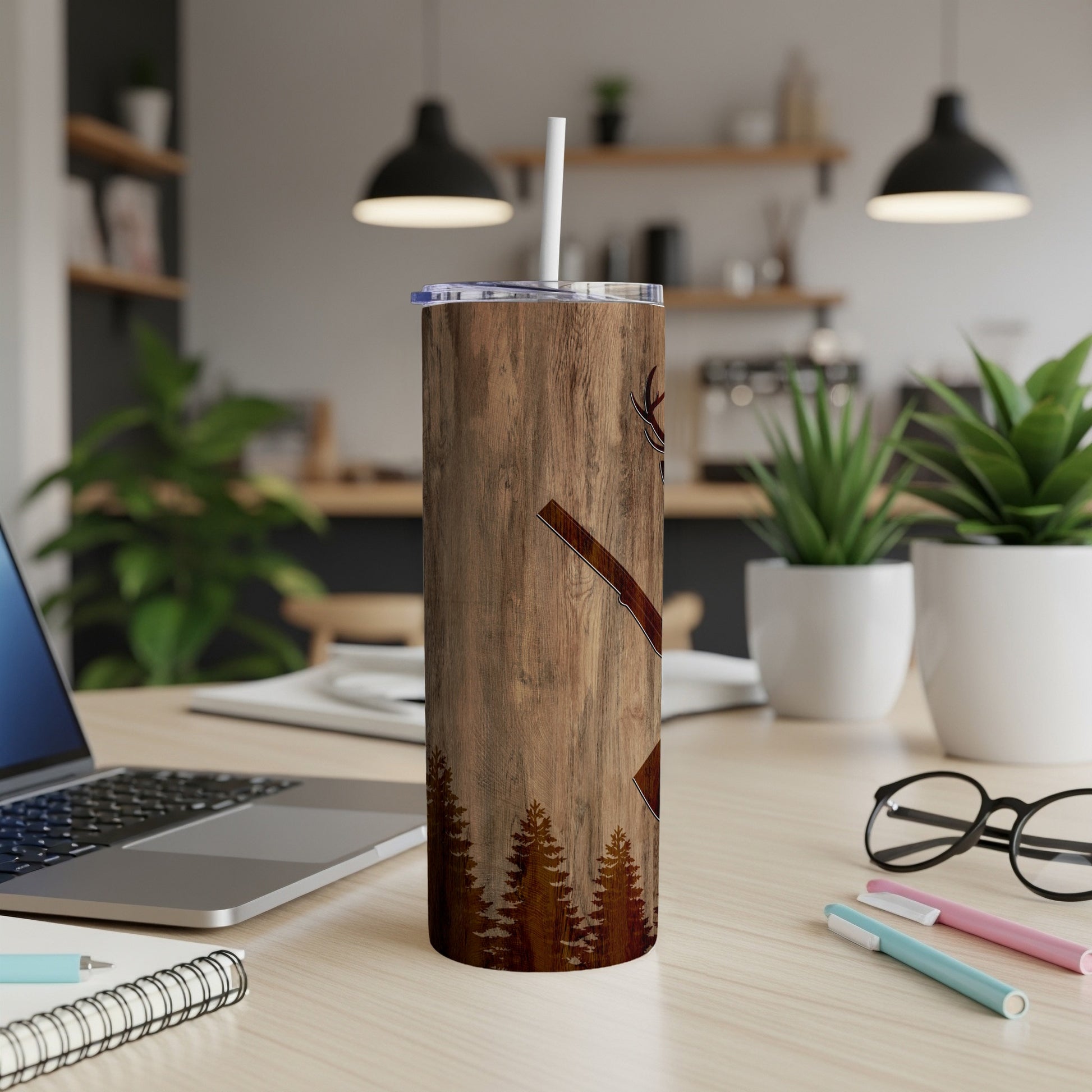 Wooden tumbler with axe graphic and forest silhouette.