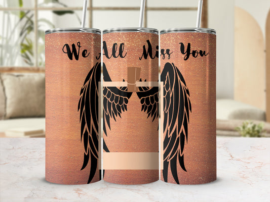 Copper tumbler with black angel wings, cross, and "We All Miss You" text.