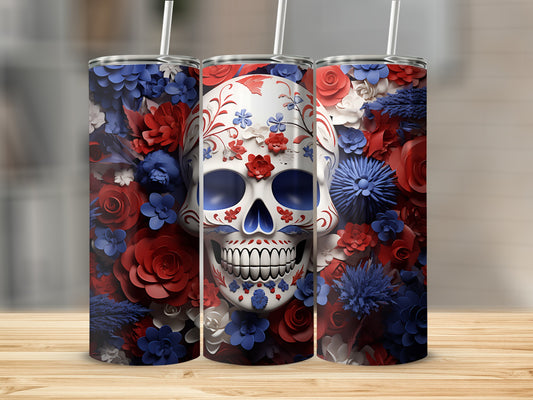 Floral skull tumbler with blue, red, and white flowers.