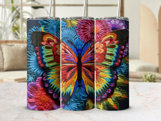 Tumbler with colorful butterfly and floral design.