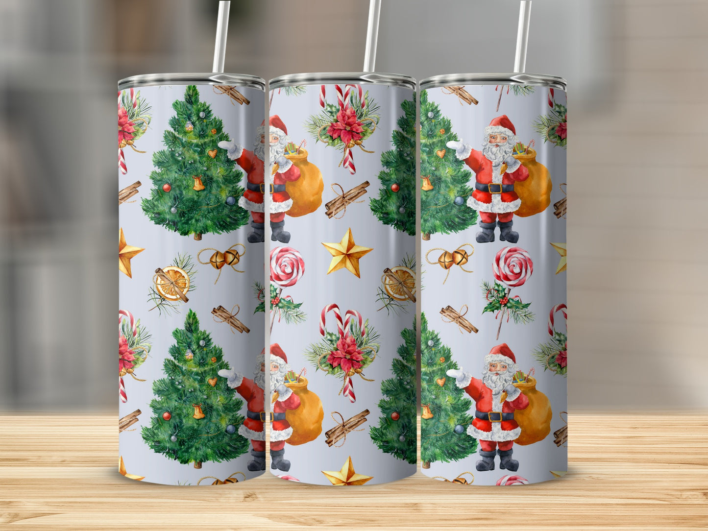 Three tumblers with a Christmas pattern featuring Santa, trees, candy canes, and ornaments.