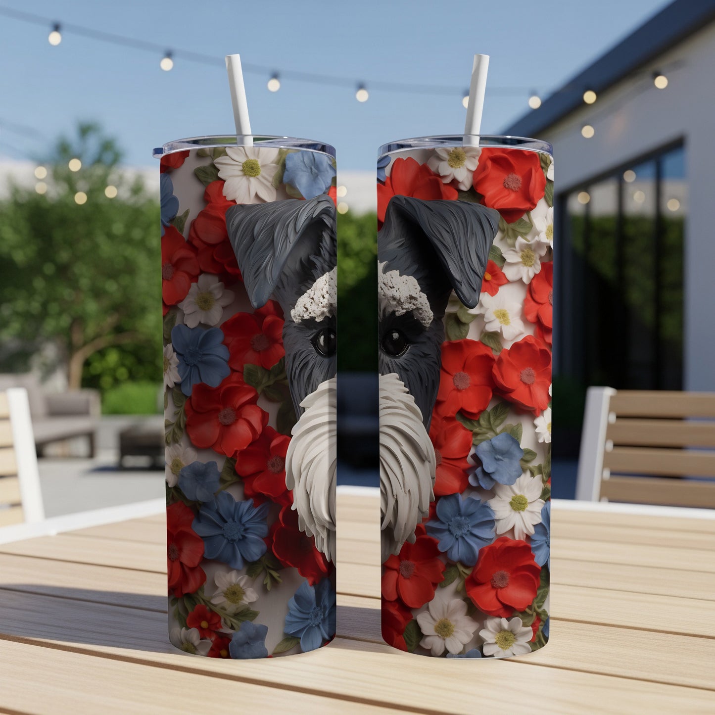 Two tumblers with a Schnauzer's face surrounded by red, white, and blue flowers.
