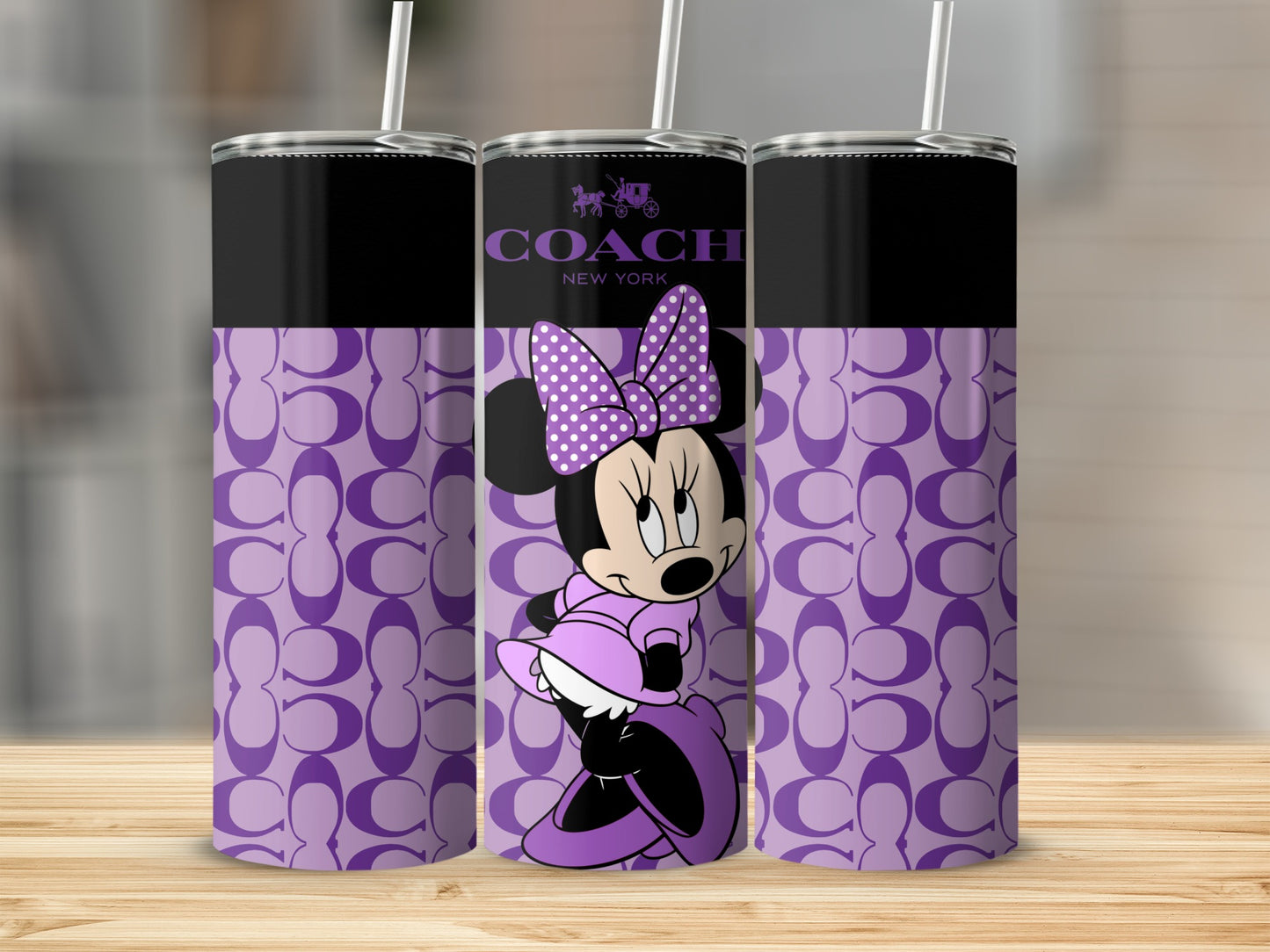 Three tumblers with Minnie Mouse and the Coach logo on a purple C pattern.