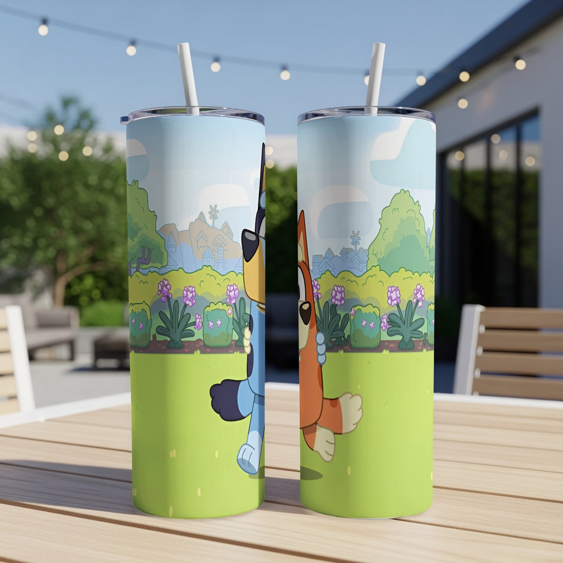 Bluey and Bingo characters on a colorful tumbler with a backyard scene.